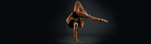 mortgage lending is a balancing act represented by woman gymnast balancing on two hands