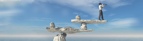 mortgage lender in business suit with telescope looking into the distance, standing on a rock ledge balanced on two other rock ledges