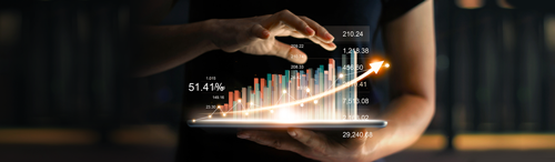 stratmor studies woman holding computer tablet with images of a graph rising above the tablet